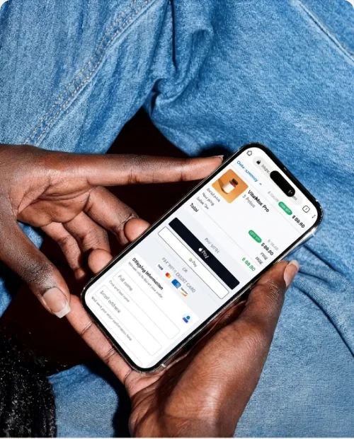 A single-page checkout on mobile, wallet buttons above the card form.